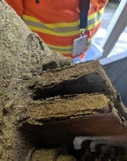 uniform corrosion workers inspecting corroded beam 